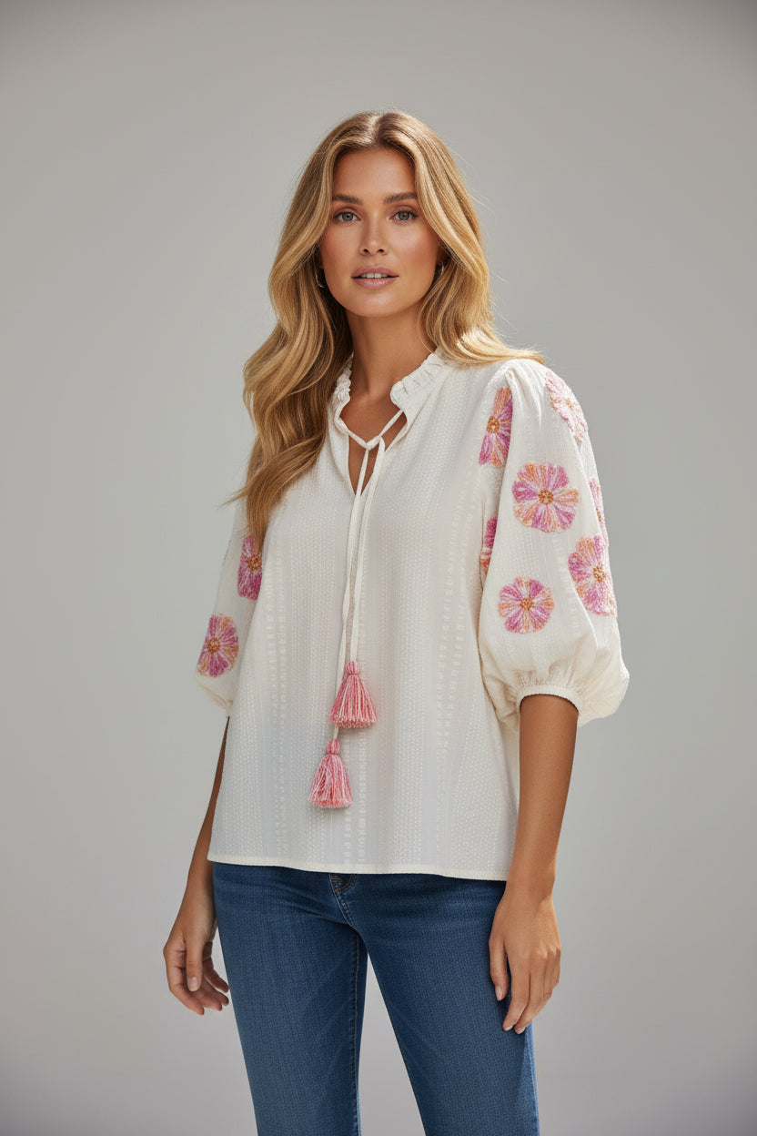 Blusa de mangas abullonadas bordadas